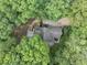 Aerial view of a home surrounded by lush trees at 284 Due West Ct, Dallas, GA 30157