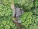 Aerial view of a home surrounded by lush trees at 284 Due West Ct, Dallas, GA 30157
