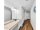 Elegant bathroom features dual sinks, granite counters, and modern lighting fixtures at 284 Due West Ct, Dallas, GA 30157