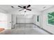 This bedroom includes a ceiling fan, plush carpets, mirrored closets and a window with wooded views at 284 Due West Ct, Dallas, GA 30157