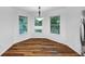 Sunny breakfast nook with large windows and hardwood flooring for a bright and inviting space at 284 Due West Ct, Dallas, GA 30157