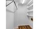 Walk-in closet with shelves and hanging rods for optimal storage at 284 Due West Ct, Dallas, GA 30157