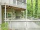 Spacious outdoor deck perfect for entertaining, featuring access to the lush, wooded surroundings at 284 Due West Ct, Dallas, GA 30157