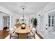 Charming dining room featuring a wooden table, modern chairs, and a stylish chandelier at 284 Due West Ct, Dallas, GA 30157