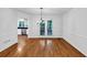 Elegant dining area with hardwood floors, chandelier, and views into the updated kitchen at 284 Due West Ct, Dallas, GA 30157