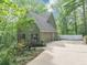 Exterior shot showcasing the driveway leading to the two-car garage at 284 Due West Ct, Dallas, GA 30157