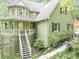 Inviting exterior of a two-story home featuring a front porch, stairs, and well-maintained landscaping at 284 Due West Ct, Dallas, GA 30157