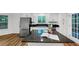 Modern kitchen featuring white cabinets, stainless steel appliances, granite countertops, and a central island at 284 Due West Ct, Dallas, GA 30157