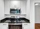 A well-equipped kitchen with stainless steel appliances and a built-in microwave at 284 Due West Ct, Dallas, GA 30157