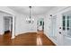 Spacious living room showing hardwood floors, elegant columns, and natural light at 284 Due West Ct, Dallas, GA 30157