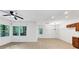 Bright living room with neutral paint, tile floor and multiple large windows for plenty of natural light at 284 Due West Ct, Dallas, GA 30157