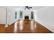 Spacious living room showcasing hardwood floors, a fireplace, and bright windows at 284 Due West Ct, Dallas, GA 30157