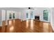 Open living area with hardwood floors, a fireplace, and access to outdoor patio at 284 Due West Ct, Dallas, GA 30157