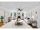 Inviting living room with a fireplace, large windows, and stylish furnishings at 284 Due West Ct, Dallas, GA 30157