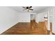 Open Living area with hardwood floors, white walls and entryways to other rooms at 284 Due West Ct, Dallas, GA 30157