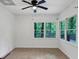 Well-lit living area featuring tile flooring and large windows overlooking the woodsy landscape at 284 Due West Ct, Dallas, GA 30157