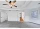 Spacious primary bedroom with tray ceiling and neutral walls at 284 Due West Ct, Dallas, GA 30157