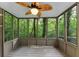 Cozy sunroom with large windows offering panoramic views of the surrounding nature at 284 Due West Ct, Dallas, GA 30157
