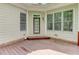 Covered back porch with wooden deck, perfect for outdoor relaxation at 7520 Ledgewood Way, Suwanee, GA 30024