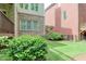 Lawn area between buildings, with manicured bushes at 7520 Ledgewood Way, Suwanee, GA 30024
