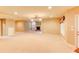 Spacious basement with carpeting, fireplace, pot lights, and natural light coming in from a window at 7520 Ledgewood Way, Suwanee, GA 30024