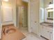 Bathroom featuring a double vanity and tiled floors at 7520 Ledgewood Way, Suwanee, GA 30024