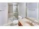 Bathroom features a glass enclosed shower, sink with wood cabinets and chrome hardware at 7520 Ledgewood Way, Suwanee, GA 30024