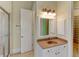 Bathroom features a walk-in shower, vanity with mirror, and neutral finishes at 7520 Ledgewood Way, Suwanee, GA 30024