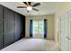 Bedroom showcases a decorative dark wall, complemented by natural light from the window at 7520 Ledgewood Way, Suwanee, GA 30024