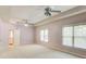 Bright and airy bedroom with dual windows and a ceiling fan for added comfort at 7520 Ledgewood Way, Suwanee, GA 30024