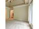A neutral toned bedroom featuring a tray ceiling and large windows at 7520 Ledgewood Way, Suwanee, GA 30024