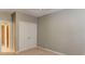 A bedroom featuring neutral-toned walls and carpet, with a double-door closet, offering ample storage at 7520 Ledgewood Way, Suwanee, GA 30024