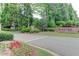 Street view of the Weston neighborhood entrance with landscaped signage at 7520 Ledgewood Way, Suwanee, GA 30024