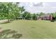 Expansive lawn area leading up to a large, luxury home at 7520 Ledgewood Way, Suwanee, GA 30024