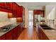 Kitchen island and breakfast bar with stainless steel appliances at 7520 Ledgewood Way, Suwanee, GA 30024