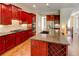 Kitchen has stainless appliances, an island and a breakfast bar at 7520 Ledgewood Way, Suwanee, GA 30024