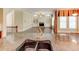 Sun-filled living space showcasing hardwood floors and a charming fireplace at 7520 Ledgewood Way, Suwanee, GA 30024
