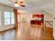 Spacious living room open to a gourmet kitchen featuring dark wood cabinets at 7520 Ledgewood Way, Suwanee, GA 30024