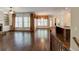 Wide-open living room with hardwood floors, fireplace, and tons of natural light at 7520 Ledgewood Way, Suwanee, GA 30024
