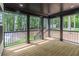 Outdoor porch view with black railings overlooking wooded backyard at 2265 Hillbriar Dr, Buford, GA 30518