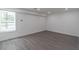 Basement featuring gray flooring and neutral walls with a bright window at 2265 Hillbriar Dr, Buford, GA 30518
