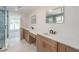 Bright bathroom with double vanity, quartz countertops, freestanding tub and tiled shower at 2265 Hillbriar Dr, Buford, GA 30518
