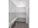 Walk-in closet with custom shelving for ample storage at 2265 Hillbriar Dr, Buford, GA 30518