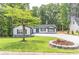 Well manicured lawn and landscaping around a modern farmhouse at 2265 Hillbriar Dr, Buford, GA 30518