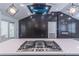 A close-up view of the kitchen island featuring a cooktop and modern lighting at 2265 Hillbriar Dr, Buford, GA 30518