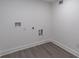 Picture of a spacious laundry room with hookups and grey wood flooring at 2265 Hillbriar Dr, Buford, GA 30518