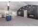 Open concept kitchen and living area with a fireplace, laminate flooring and ample lighting at 2265 Hillbriar Dr, Buford, GA 30518