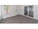 Well-lit sunroom with sliding glass doors and gray wood floor at 2265 Hillbriar Dr, Buford, GA 30518