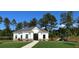 Charming community clubhouse featuring a walkway, well-manicured lawn, and access to outdoor recreation areas at 2348 Argento Cir, Dacula, GA 30019