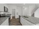 Spacious kitchen with stainless steel appliances, island with sink and granite countertops at 2348 Argento Cir, Dacula, GA 30019